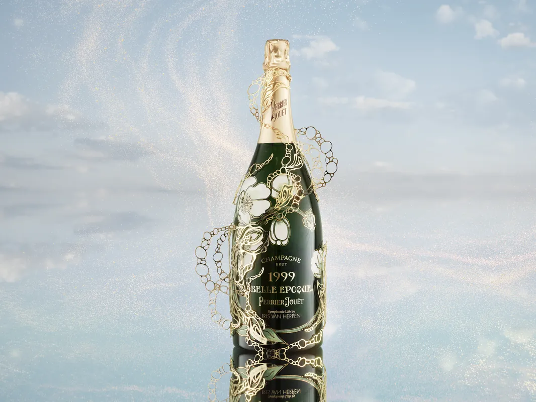Symphonic Life by Iris van Herpen: Perrier-Jouët Belle Epoque 1999 magnum with a sculptural 22-carat gold sleeve against a reflected sky